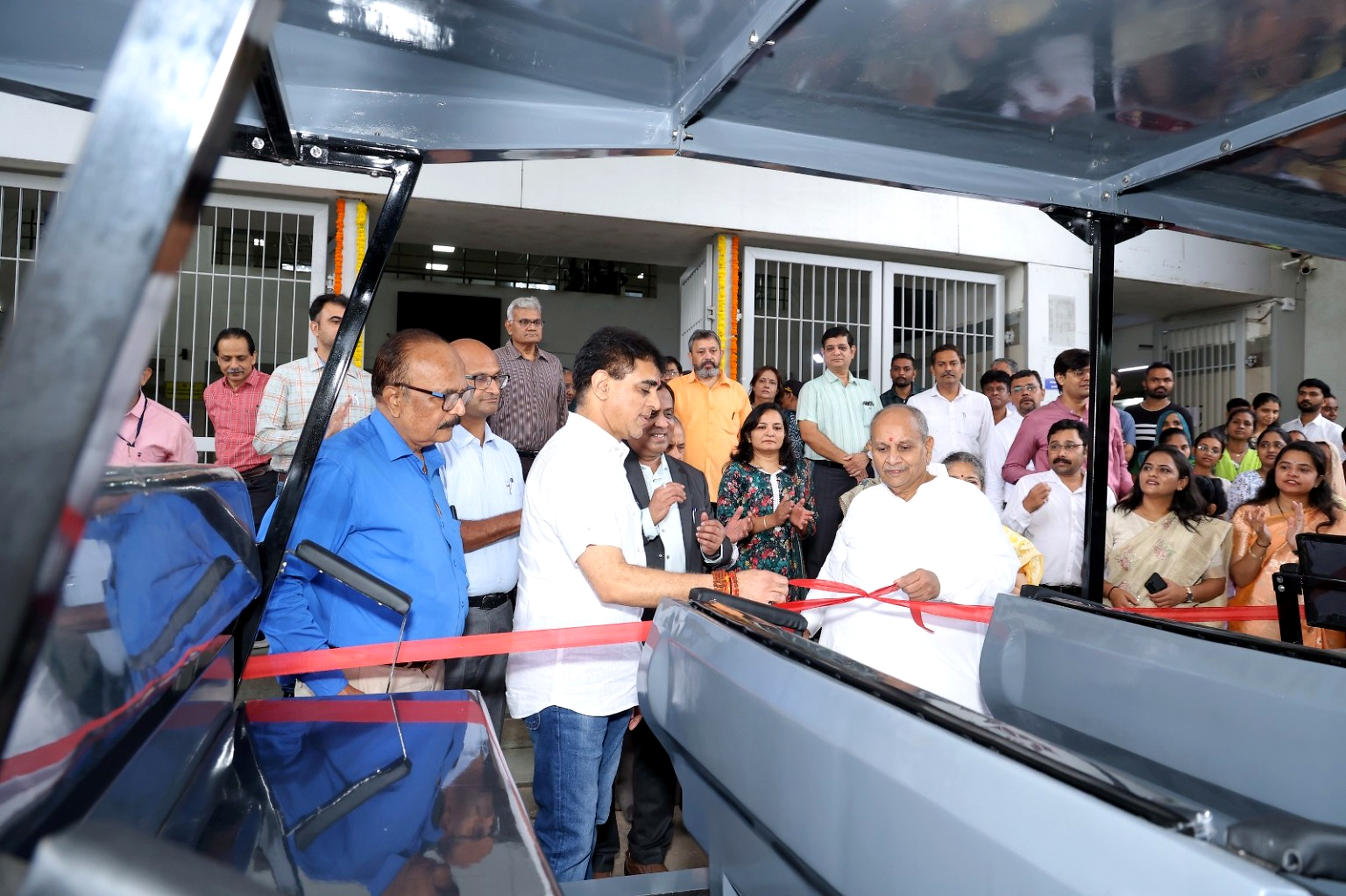 Formal handover of the campus shuttle vehicle at Civil Hospital, Ahmedabad